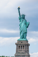 Fototapeta premium New York, NY - USA - July 30, 2021: Closeup vertical view of the Statue of Liberty, a colossal neoclassical sculpture on Liberty Island in New York Harbor within New York City.
