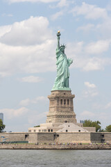 Fototapeta na wymiar New York, NY - USA - July 30, 2021: Vertical view of the Statue of Liberty, a colossal neoclassical sculpture on Liberty Island in New York Harbor within New York City.