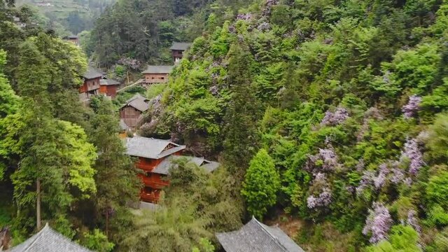 Aerial view of traditional wooden building cluster of Xijiang Qianhu Miao Village (The One Thousand Household Miao Village) , in southeastern Guizhou province of China.