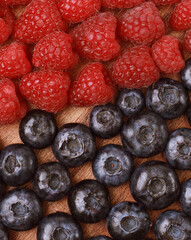 Healthy eating, food and diet concept. Raspberries and blueberries. Top view.