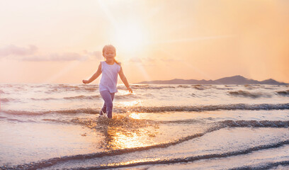 Girl on the beach on the sunset