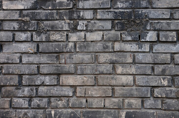 Horizontal part of grey painted brick wall, close up