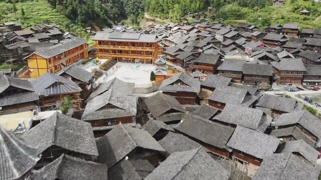 Aerial view of traditional wooden building cluster of Xijiang Qianhu Miao Village (The One Thousand Household Miao Village) , in southeastern Guizhou province of China.