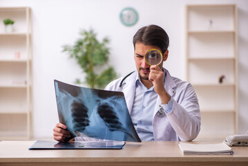 Young male doctor radiologist working in the clinic