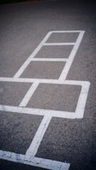 Hopscotch on asphalt school playground