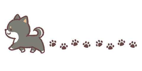 歩く黒柴犬と足跡のライン