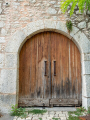 classic carriage door in small provencal village in the French Riviera back country