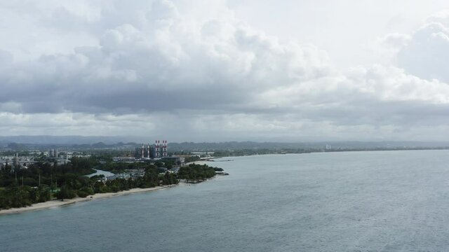 Slow descending aerial over the coastline along Isla de Cabra, Puerto Rico