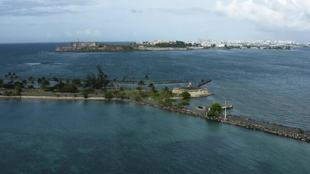 Wide aerial push in shot to the old fort on Isla de Cabra on Puerto Rico - a popular tourist destination. A former defence battery.