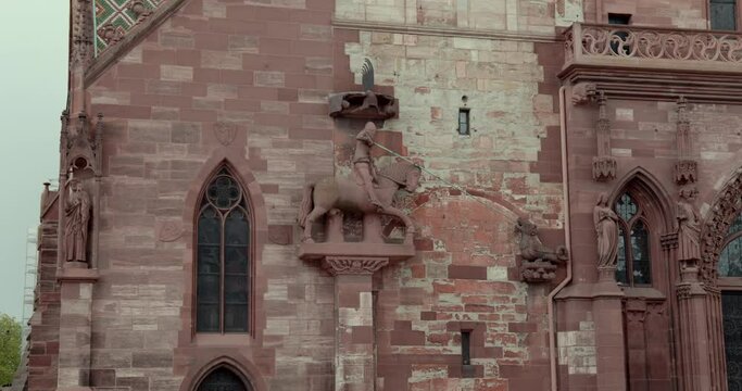 View from below of the Basler M&uuml;nster cathedral with a detail of the decorations on the left side