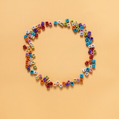 letter shaped beads Many people's hobbies are placed on a yellow circle background.