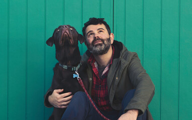 Man and dog looking up.