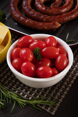 Appetizer jars with cherry tomatoes.
