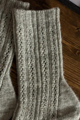 Dark gray knitted men socks close up, woolen texture