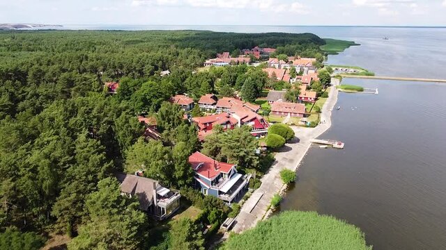 Small luxury coastal town of Pervalka in Neringa region, Lithuania. Aerial fly over view