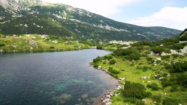 Flight over the Popovo Lake, a glacial lake situated in the northern section of the Pirin mountain range in Bulgaria.