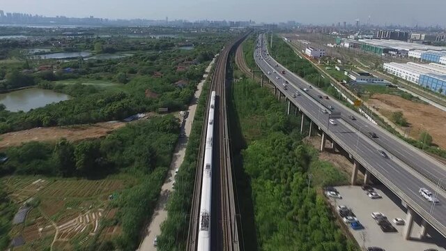 High-speed train moves by rail in wuhan, China. (aerial photography)