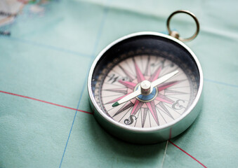 Fototapeta na wymiar Closeup of compass on the map