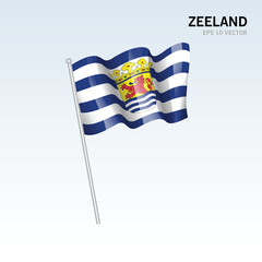 Waving flag of Zeeland provinces of Netherlands isolated on gray background