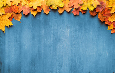 Autumn maple leaves on ancient texture. Falling leaves natural background. Seasonal background.