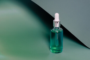 Dropper glass bottles with pipette. Transparent hyaluronic natural beauty mineral product and eco serum skin care concept. Top horizontal view copyspace. Summer juicy colors