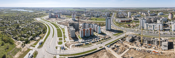 aerial view of large urban construction site. building new apartment blocks in residential area. panoramic photo.