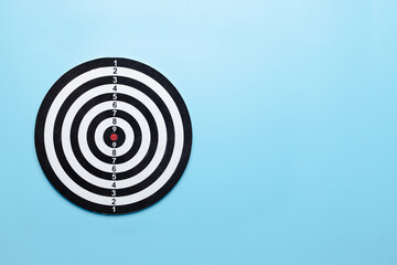 Dart target board on blue background