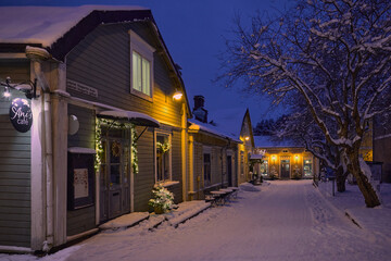 Winter evening in Porvoo, old wooden houses on the streets of the old town. 