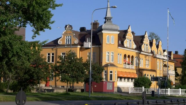 Pan right shot of baroque style old building, now occupied by a famous restaurant Restaurang Temperance in &Ouml;stersund Sweden.