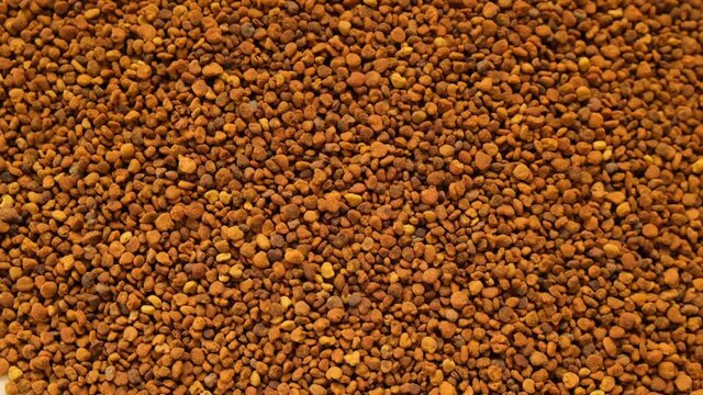 Honey and pollen.propolis background. Honey products. Beekeeping product. honey propolis granules close-up. Fast rotation. High quality 4k footage