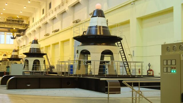 Huge turbines in a row inside of Novosibirsk hydroelectric power plant station on the Ob River