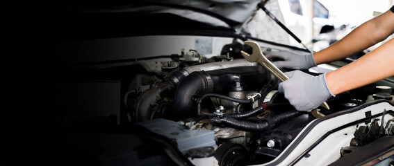 Fototapeta na wymiar Car mechanic working on car engine, car maintenance concept. 