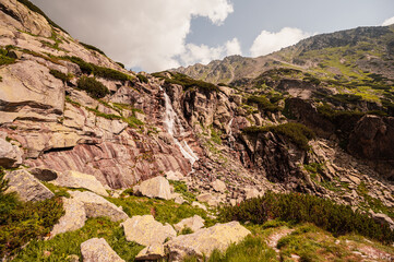 Fototapeta na wymiar Mountain valley with waterfall Skok. High Tatras national park , Mlynicka dolina, Slovakia landscape.