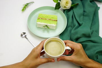 Pandan sponge cake with coconut, cream, butter and green tea. 