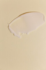 Cosmetic cream texture on neutral background