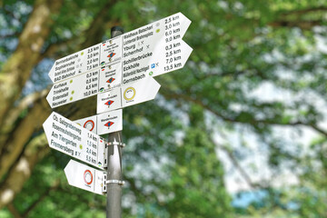 Baden-Baden, Germany - Signpost with signs showing directions and distance to various sight seeing place of interest in world heritage sites in spa town