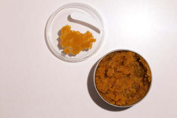 Body scrub of oatmeal, sugar, honey and oil in melat eco jar on white table, homemade cosmetic for peeling and spa care