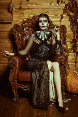 elegant lady with skull pumpkin makeup