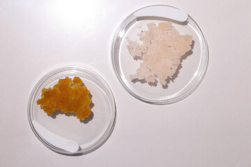 Body scrub of oatmeal, sugar, honey and oil in melat eco jar on white table, homemade cosmetic for peeling and spa care