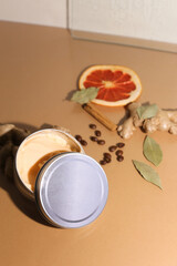 Obraz na płótnie Canvas Cosmetic jar of marigold soothing body care cream, fresh orange calendula flowers