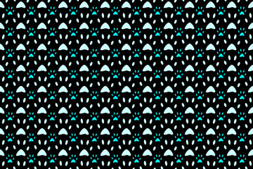 Seamless wallpaper with tiled cute dog footprints on a black background.