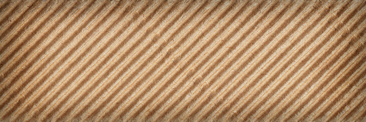 Patterned texture of corrugated cardboard. Abstract background. Banner, close-up.