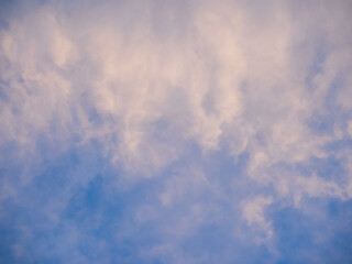soft smoky clouds on blue evening sky, tranquil background