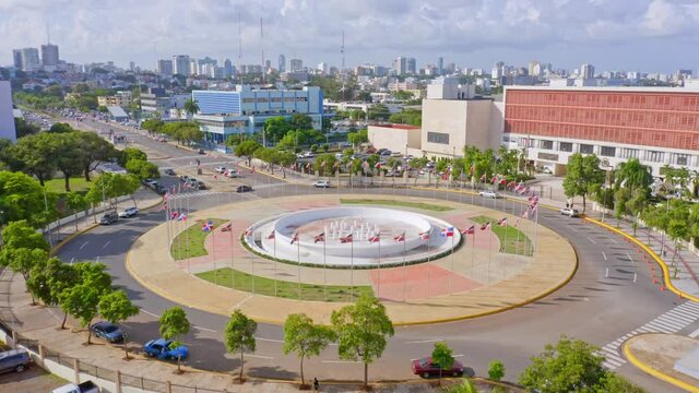 Elevated view at Congress of the Dominican Republic roundabout, Jimenez Moya Avenue, 
Santo Domingo; aerial pan shot displaying numerous country flags in circle