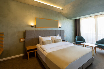 Interior of a luxury hotel double bed bedroom