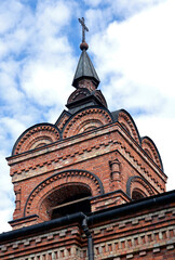 Fototapeta na wymiar Built in 1890 as an Orthodox Church, now the Catholic Church of St. Wojciech in the city of Ostrołęka in Masovia, Poland. The photos show architectural details and a general view of the temple.