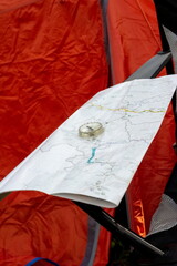 compass on the tourist map of the Altai Territory. Focus on the compass needle