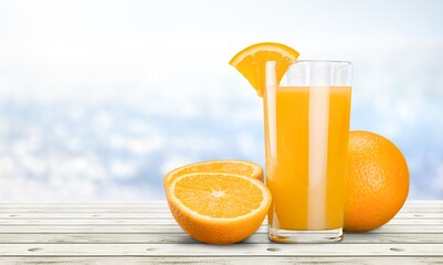 Orange juice in glass and slices of orange fruit