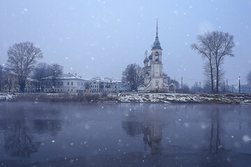 Fototapeta na wymiar winter landscape church on the banks of the freezing river in vologda, christianity baptism russia christmas