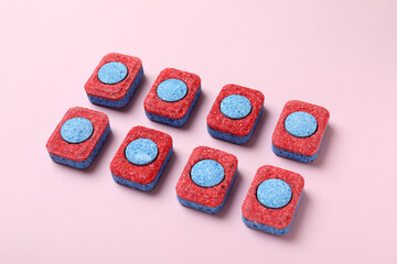 Concept of Dishwashing detergent accessories on pink background